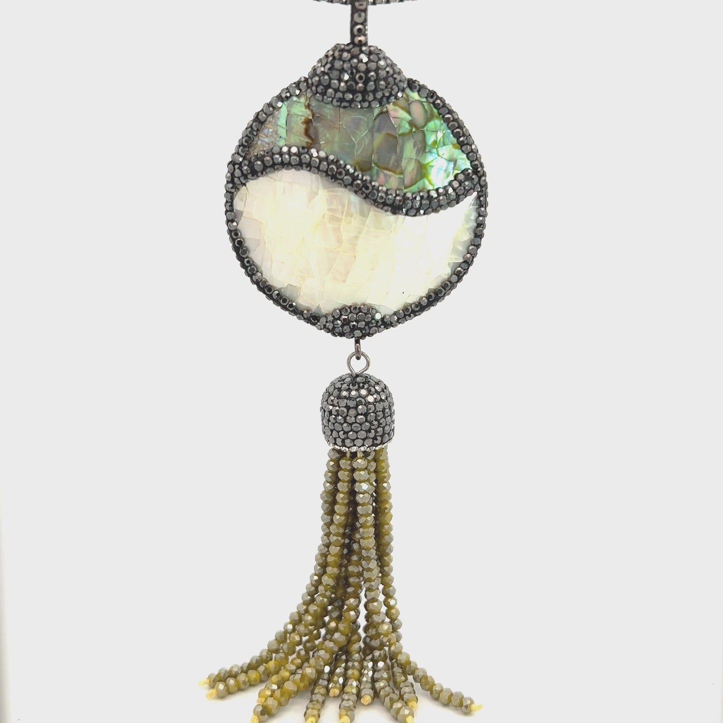 Load and play video in Gallery viewer, Mother of Pearl Green Tassel Pendant
